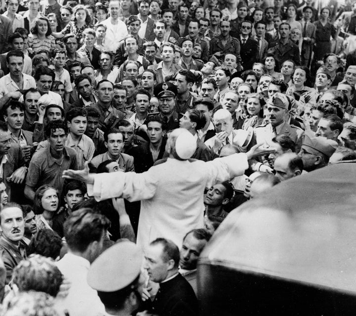 Pius XII on an inspection tour of Rome after an American air raid, Oct. 15, 1943.