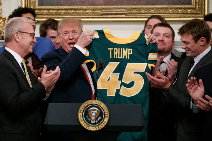 Trump was given a jersey by the football team in the state dining room of the White House.