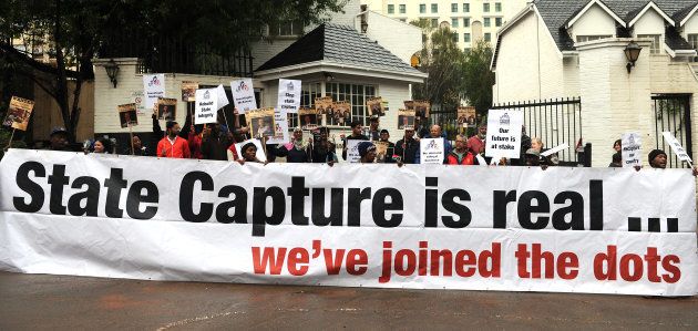 Future SA supporters picket outside the McKinsey offices on October 05, 2017 in Sandton, South Africa. The civil society group protested against the way in which the global company conducted itself in relation to its empowerment partner Trillian Capital and their business deals with Eskom. (Photo by Felix Dlangamandla/Foto24/Gallo Images/Getty Images)