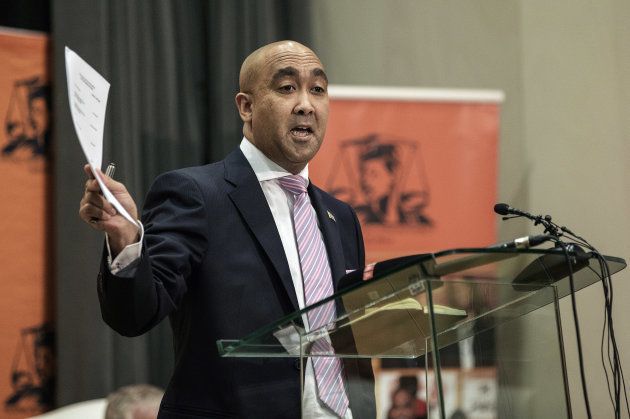 South African National Prosecuting Authority Shaun Abrahams holds the appeal papers during a press conference on May 23, 2016 at the NPA Head Office in Pretoria, SOuth Africa. The National Prosecuting Authority will seek leave to appeal a court ruling that corruption charges must be reinstated against South African President Jacob Zuma. / AFP / GIANLUIGI GUERCIA (Photo credit should read GIANLUIGI GUERCIA/AFP/Getty Images)