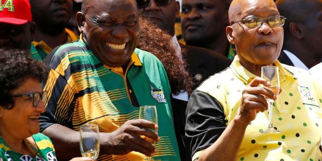 African National Congress (ANC) President Cyril Ramaphosa (L) reatcs as he celebrates the Congress' 106th anniversary celebrations with President of South Africa Jacob Zuma, in East London, South Africa, January 13, 2018. REUTERS/Siphiwe Sibeko 2pts