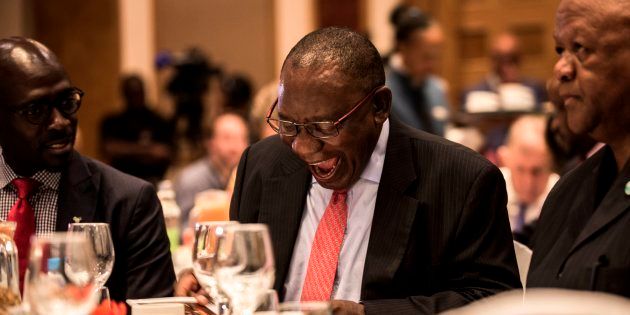 Deputy President Cyril Ramaphosa (C) reacts while flanked by Minister of Finance Malusi Gigaba (L) and Minister in the Presidency for Planning, Monitoring and Evaluation, Mr Jeff Radebe (R) during the Pre-World Economic Forum (WEF) Breakfast ahead of the WEF Annual meetings in Davos, at the Hilton Hotel in Sandton on January 18, 2018.