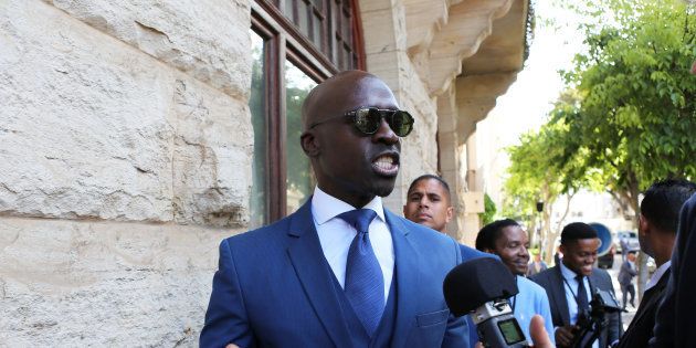 Finance Minister Malusi Gigaba speaks to members of the media after delivering his medium-term budget speech in Parliament, in Cape Town, South Africa, October 25, 2017.