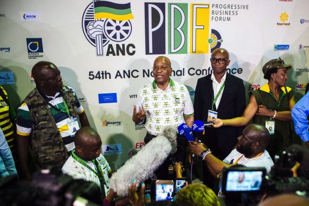 Jacob Zuma, South Africa's president, center, and Zizi Kodw, national spokesman for the African National Congress party.