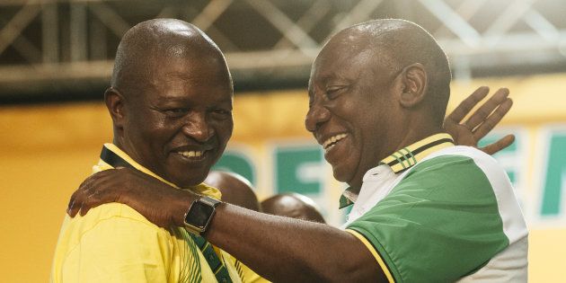 Cyril Ramaphosa, South Africa's deputy president and newly elected president of the African National Congress party (ANC), right, embraces David Mabuza, on Monday, Dec. 18, 2017.