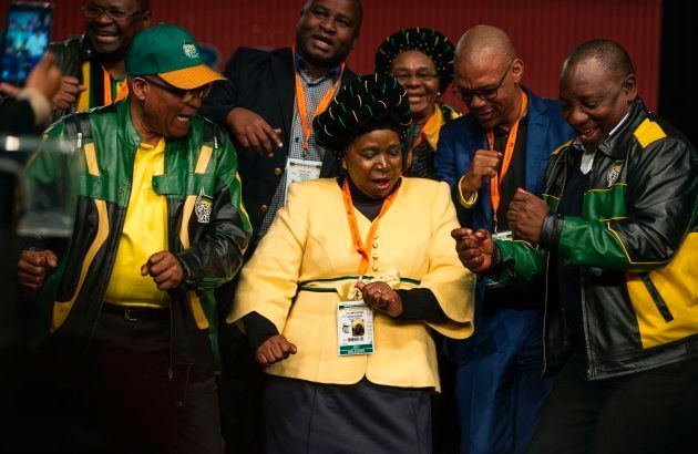 South African President Jacob Zuma (L), former African Union Chairperson Nkosazana Dlamini-Zuma (C) and South African Deputy President Cyril Ramaphosa (R). (Photo credit should read MUJAHID SAFODIEN/AFP/Getty Images)