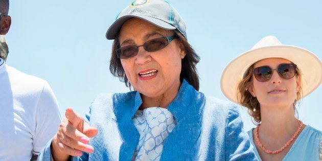 Cape Town City Mayor Patricia de Lille (C) talks to media at a site where the city council has ordered drilling into the aquifer to tap water, in Mitchells Plain, about 25km from the city centre on January 11, 2018 in Cape Town.