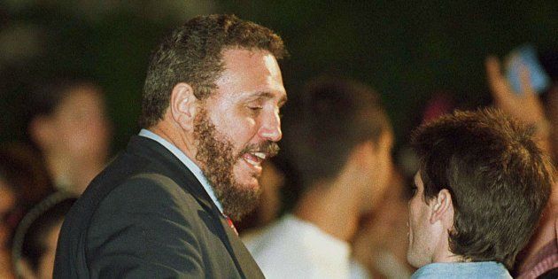 Fidel Castro Diaz-Balart (L), oldest son of Cuban President Fidel Castro, speaks with presidential aid Carlos Valenciaga 09 February, 2000, in Havana, during a rally demanding the return of Elian Gonzalez to Cuba.