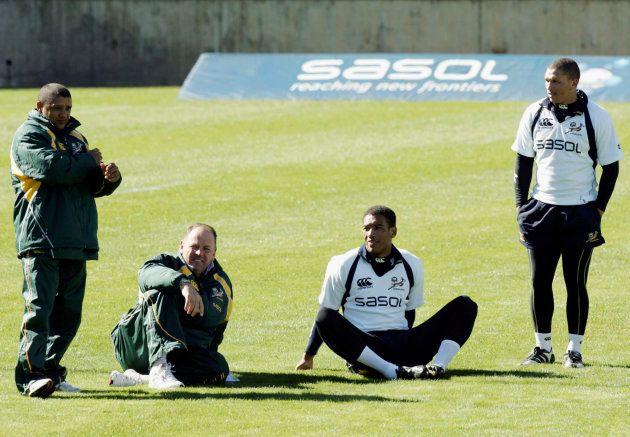 Allistair Coetzee, Jake White, Ashwin Willemse and Enrico Januarie look on during a Springbok training session.