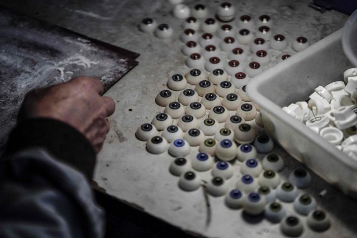 This photo taken on February 1, 2018 shows a worker making the eyes for silicone dolls at a doll factory of EXDOLL, a firm based in the northeastern Chinese port city of Dalian. With China facing a massive gender gap and a greying population, a company wants to hook up lonely men and retirees with a new kind of companion: "Smart" sex dolls that can talk, play music and turn on dishwashers. / AFP PHOTO / FRED DUFOUR / TO GO WITH China-sex-lifestyle, FOCUS by Joanna CHIUFRED DUFOUR/AFP/Getty Images