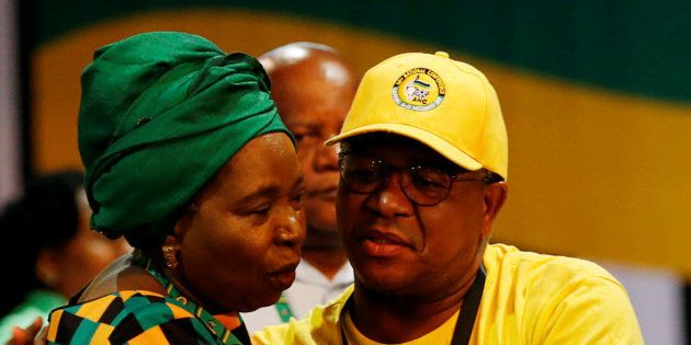 Police Minister Fikile Mbalula (R) comforts Nkosazana Dlamini-Zuma, former minister and chairperson of the African Union Commission, during the 54th National Conference of the ruling African National Congress (ANC) at the Nasrec Expo Centre in Johannesburg, South Africa December 18, 2017.