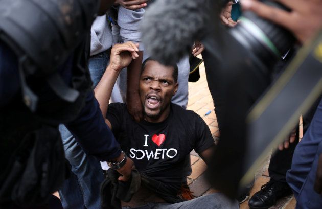 Student leader Mcebo Dlamini is detained during clashes with South African police at Johannesburg's University of the Witwatersrand, South Africa, October 4,2016. REUTERS/Siphiwe Sibeko
