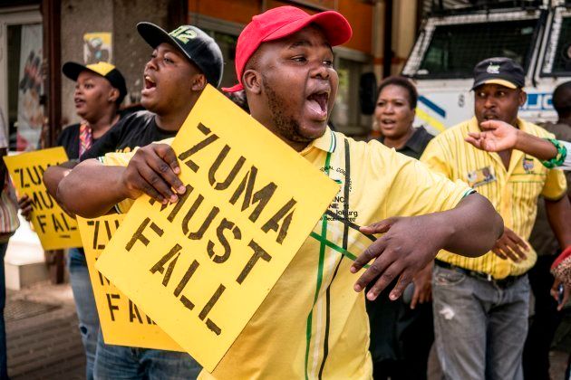 ANC members protest on Monday against President Jacob Zuma outside Luthuli House, the party's headquarters in Johannesburg.
