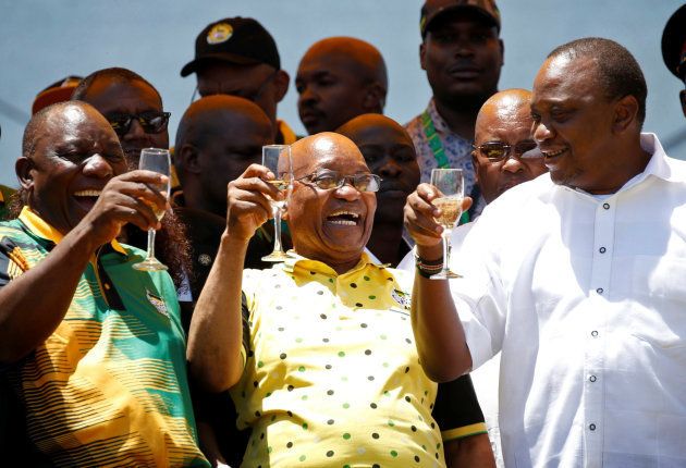African National Congress (ANC) President Cyril Ramaphosa (L) celebrates the Congress' 106th anniversary celebrations with Kenyan President Uhuru Kenyatta (R) and president of South Africa Jacob Zuma, in East London, South Africa, January 13, 2018.