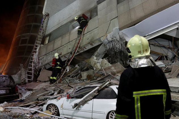 A fireman works at a collapses building after earthquake hit Hualien, Taiwan February 7, 2018.