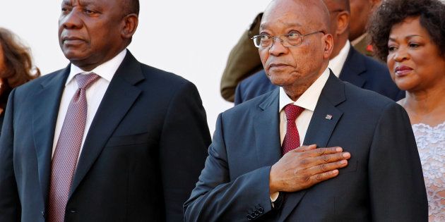 South Africa's Deputy President Cyril Ramaphosa (L) and President Jacob Zuma listen to the national anthem at the opening of Parliament in Cape Town, South Africa February 11, 2016. REUTERS/Mike Hutchings/File Photo