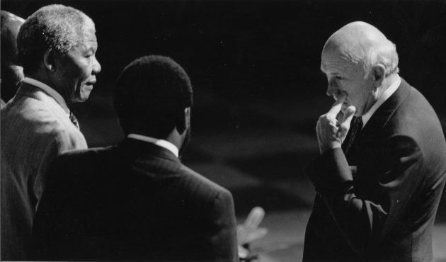 December 20, 1991: Nelson Mandela talks to FW de Klerk with Cyril Ramaphosa during CODESA talks.