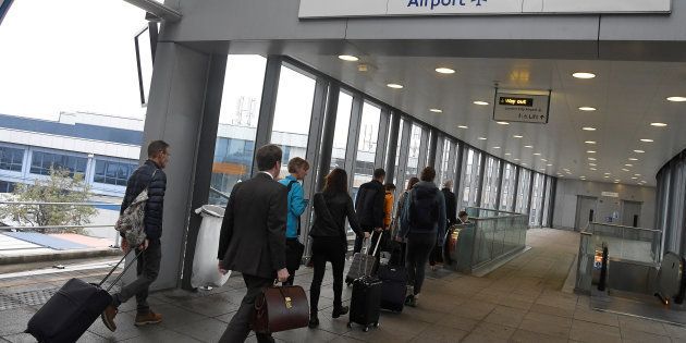 Passengers alight from a train to enter City Airport in London, Britain, October 18, 2017. Picture taken October 18, 2017.