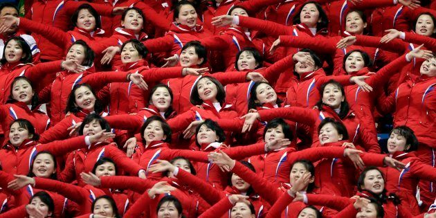 North Korean cheerleaders perform as Un Song Choe competes at the men's 1500 meters in the Gangneung Ice Arena at the 2018 Winter Olympics in Gangneung, South Korea on Feb. 10, 2018.