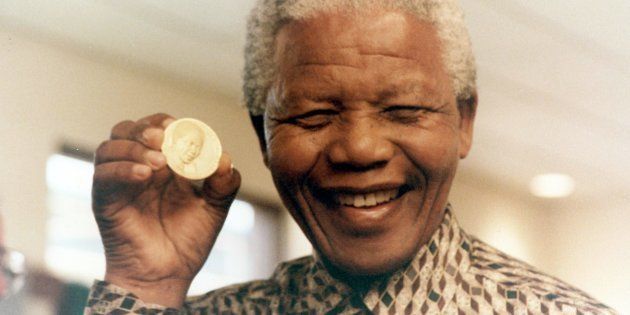 Former president Nelson Mandela in a file photo at the South African Mint where the first presidential coin was launched. It depicts the inauguration of Mandela in 1994.