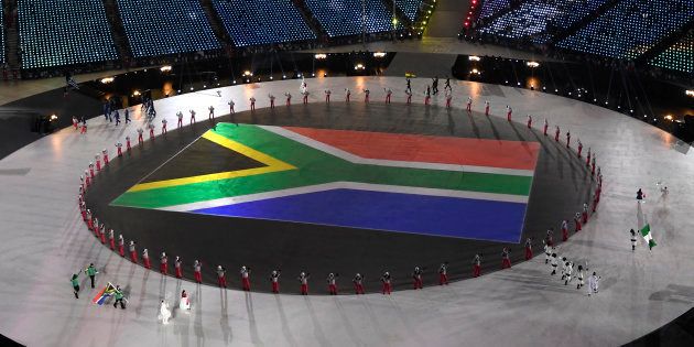 The flag of South Africa is paraded during the opening ceremony of the Pyeongchang 2018 Winter Olympics on February 9, 2018.