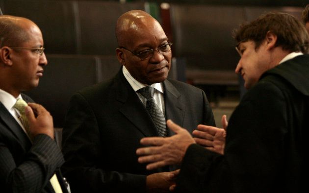 African National Congress (ANC) president Jacob Zuma (C) is briefed by his attorneys at the Constitutional Court in Johannesburg March 12, 2008.