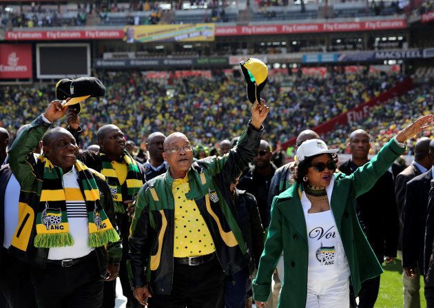 African National Congress (ANC) president Jacob Zuma (C) waves to his supporters next to his deputy, Cyril Ramaphosa (L) .