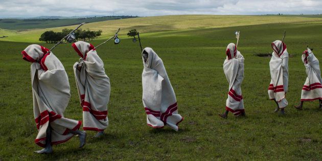 Xhosa initiates pass by close to the funeral of Nelson Mandela, Qunu, South Africa, 14 December 2014.