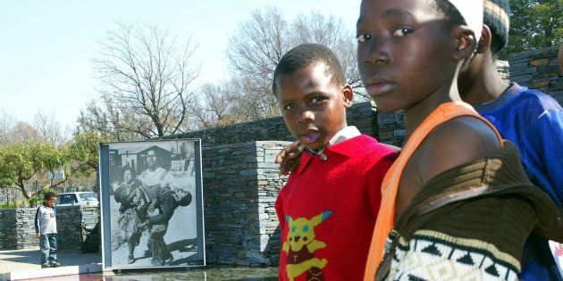 Children visit the Hector Peterson memorial in Soweto.