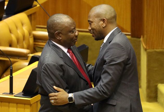 President of South Africa Cyril Ramaphosa is hugged by Democratic Alliance Party leader Mmusi Maimane after Ramaphosa was elected president in parliament in Cape Town, South Africa, February 15, 2018. REUTERS/Mike Hutchings