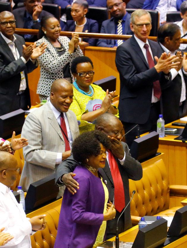 President of South Africa Cyril Ramaphosa hugs Parliament Speaker Baleka Mbete as he is applauded by MPs after being elected President in Parliament in Cape Town, South Africa, February 15, 2018. REUTERS/Mike Hutchings