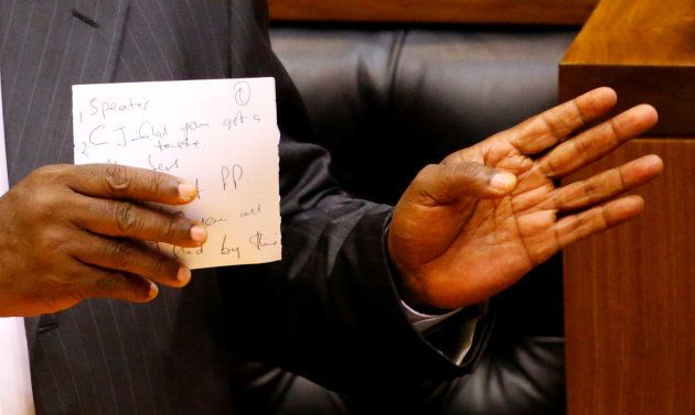 President of South Africa Cyril Ramaphosa holds his speech notes as he addresses MPs after being elected president in parliament in Cape Town, South Africa, February 15, 2018. REUTERS/Mike Hutchings