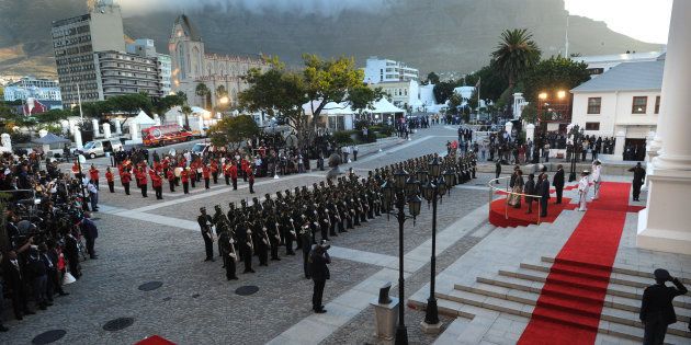 South Africa's newly-minted president Cyril Ramaphosa reviews a guard of honour as he arrives to deliver his State of the National address at the Parliament in Cape Town, on February 16, 2018.The State of the Nation address is an annual mix of political pageantry and policy announcements, but the flagship event was postponed last week as Zuma battled to stay in office. / AFP PHOTO / POOL / Brenton GEACH (Photo credit should read BRENTON GEACH/AFP/Getty Images)