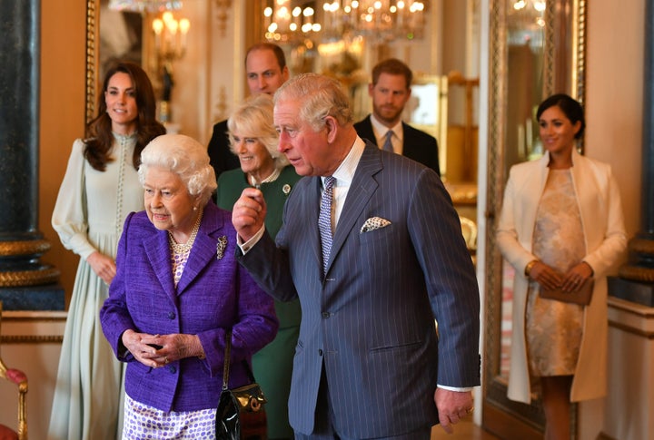 Catherine, Duchess of Cambridge, Camilla, Duchess of Cornwall, Prince William, Duke of Cambridge, Prince Harry, Duke of Sussex, Queen Elizabeth II, Prince Charles, Prince of Wales and Meghan, Duchess of Sussex attend a reception to mark the 50th anniversary of the investiture of the Prince of Wales at Buckingham Palace on March 5 in London.