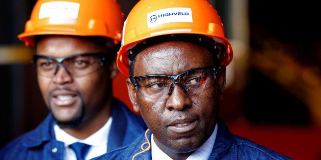 Mineral Resources Minister Mosebenzi Zwane (R) looks on during the reopening of the Highveld Steel heavy structural mill at Emalahleni in Mpumalanga province, South Africa June 6, 2017.