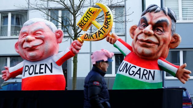 A carnival float depicting leader of the ruling party Law and Justice (PiS) in Poland Jaroslaw Kaczynski and Hungarian Prime Minister Viktor Orban at the traditional "Rosenmontag" Rose Monday carnival parade in Duesseldorf, Germany, February 12, 2018.