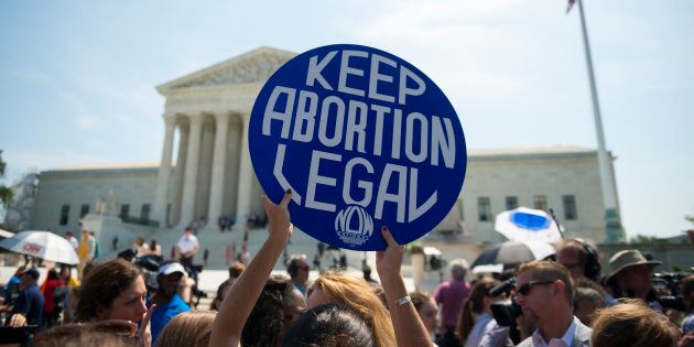 Pro-choice supporters celebrate in front of the U.S. Supreme Court after the court, in a 5-3 ruling, struck down a Texas law restricting access to abortion.