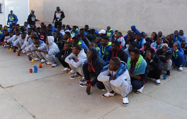 Migrants from Niger wait before they are deported by Libyan authorities, in Misrata, Libya, February 19, 2018.