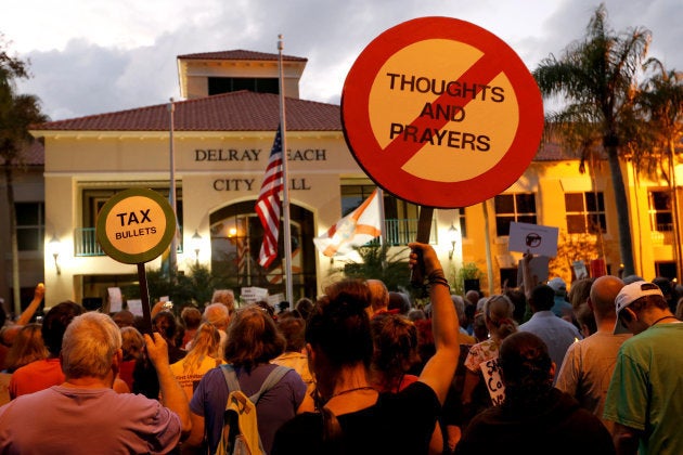 Protesters take part in a Call To Action Against Gun Violence rally by the Interfaith Justice League and others in Delray Beach, Florida, U.S. February 19, 2018. REUTERS/Joe Skipper