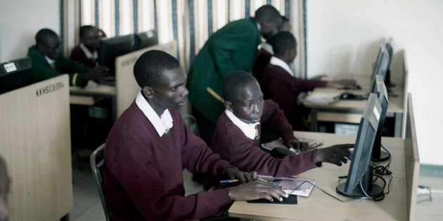 Jonathan Kitum (16) with a friend during a computer class at Kipkeino Highschool.