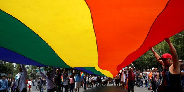 Participants carry a rainbow flag during the Gay Pride Parade in Mexico City last week.