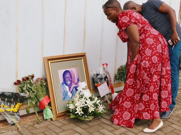 Mourners place flowers as they pay respects to Movement For Democratic Change (MDC) leader Morgan Tsvangirai at his residence in Harare, Zimbabwe February 17, 2018. REUTERS/Philimon Bulawayo