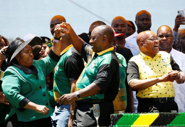 President Cyril Ramaphosa (C) dances with former South Africa President Jacob Zuma (R) and Nkosazana Dlamini Zuma (L) during the Congress' 106th anniversary celebrations, in East London, South Africa, January 13, 2018. REUTERS/Siphiwe Sibeko