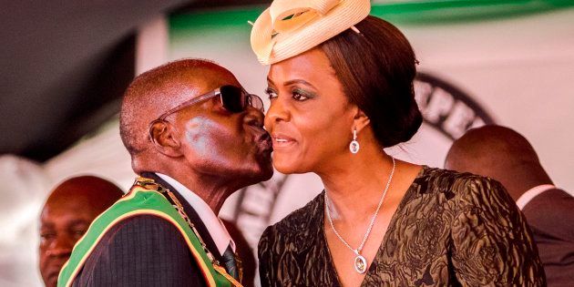 Robert Mugabe kissing his wife and then-first lady Grace Mugabe during during Zimbabwe's 37th Independence Day celebrations in 2017.