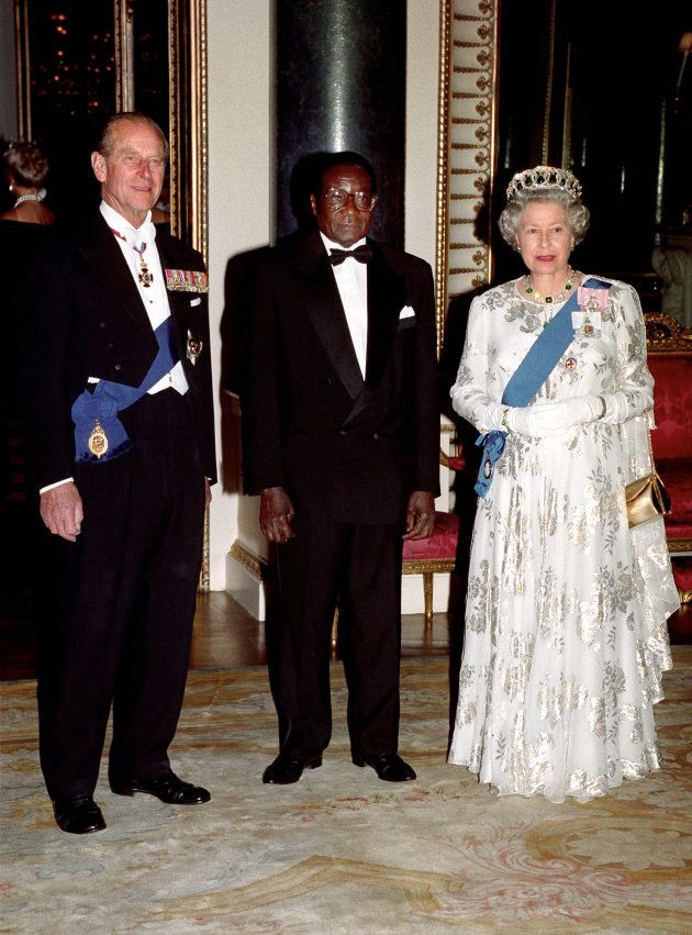 File photo dated 17/05/1994 of Queen Elizabeth II and the Duke of Edinburgh with Robert Mugabe before a state banquet at Buckingham Palace. Mr Mugabe has resigned as president of Zimbabwe.