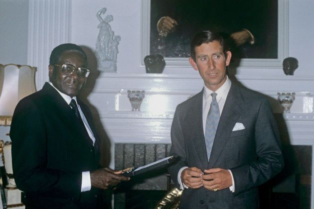 File photo dated 19/04/1980 of the Prince of Wales receiving an Independence Medal from Robert Mugabe, who has resigned as president of Zimbabwe.