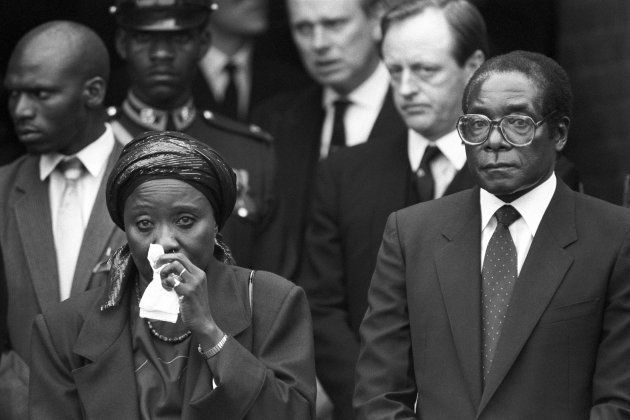 Robert Mugabe with his wife Sally at Lord Soames funeral at All Saints Curch, Odiham Lord Soames a former governor of Rhodesia, aided Mugabe in the early days of his country's independence.