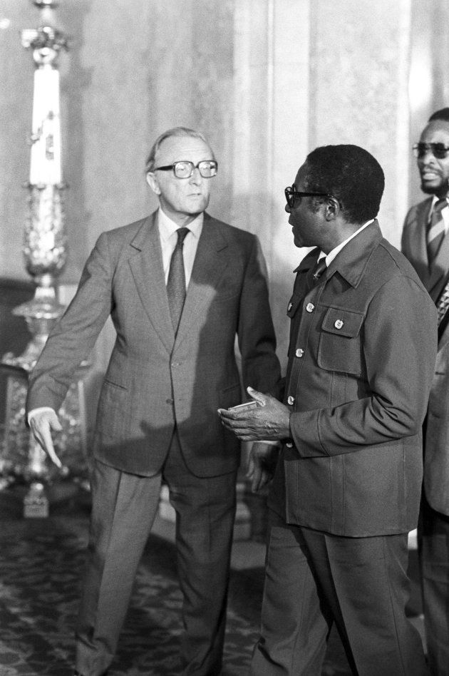 Lord Carrington Foreign Secretary (left) speaks to Robert Mugabe as he greeted the delegates at Lancaster house at the opening of the Zimbabwe Rhodesia constitutional conference.