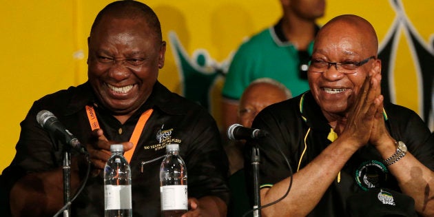 South Africa's President Jacob Zuma (R) jokes with his party's newly appointed Deputy President Cyril Ramaphosa at the National Conference of the ruling African National Congress (ANC) in Bloemfontein December 18, 2012. South Africa's ruling ANC re-elected Zuma as its leader on Tuesday, setting him up for seven more years as head of state of Africa's biggest economy. REUTERS/Mike Hutchings (SOUTH AFRICA - Tags: POLITICS ELECTIONS)