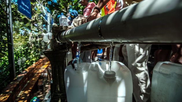 Cape Town residents queue to refill water bottles at Newlands Spring on January 30, 2018 in Cape Town, South Africa. (Photo by Morgana Wingard/Getty Images)